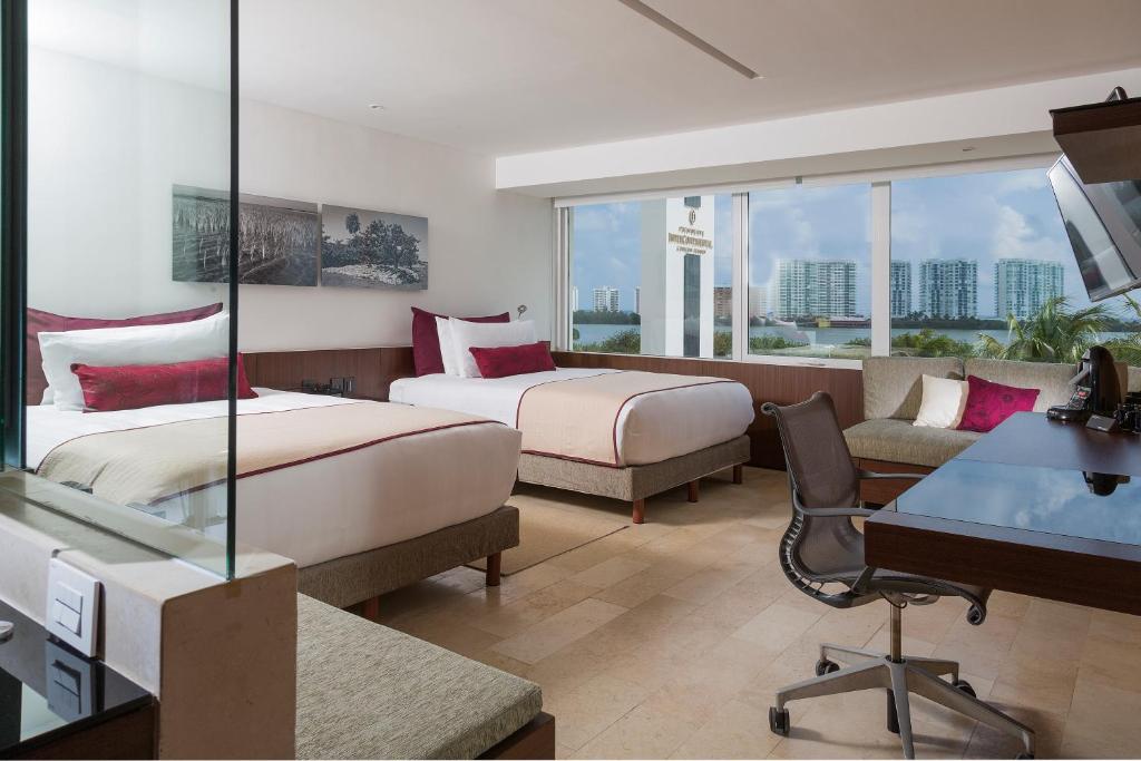 Postel nebo postele na pokoji v ubytování Presidente InterContinental Cancun Resort
