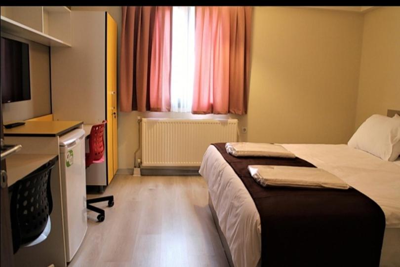 Postel nebo postele na pokoji v ubytování Moda Hotel