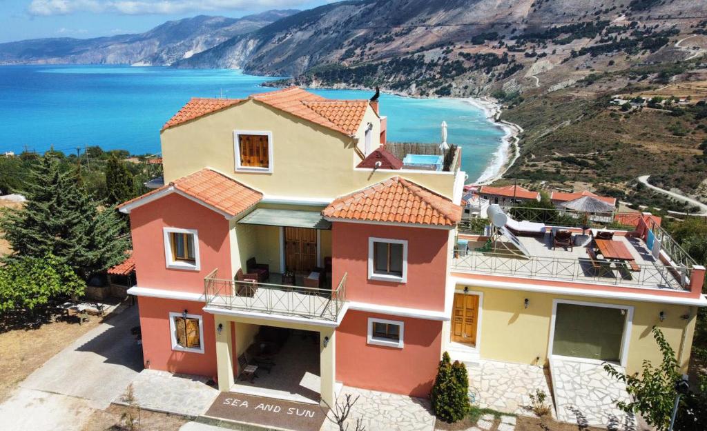 a house with a view of the ocean at Villa Alexandros in Zóla