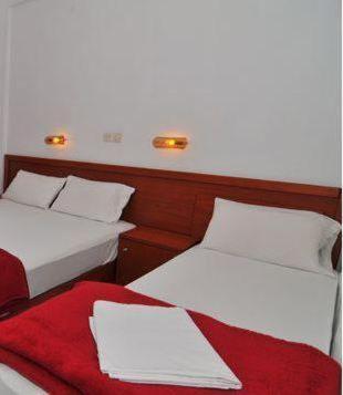 Postel nebo postele na pokoji v ubytování Chrissafis Hotel