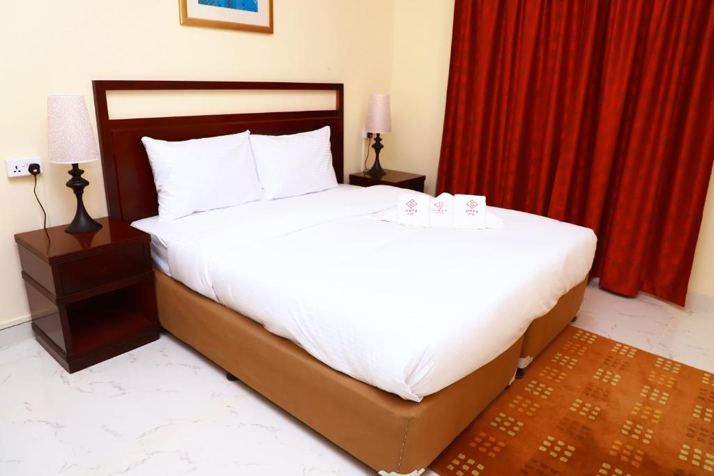 Postel nebo postele na pokoji v ubytování Onyx Hotel Apartments - MAHA HOSPITALITY GROUP