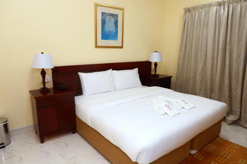 Postel nebo postele na pokoji v ubytování Onyx Hotel Apartments - MAHA HOSPITALITY GROUP