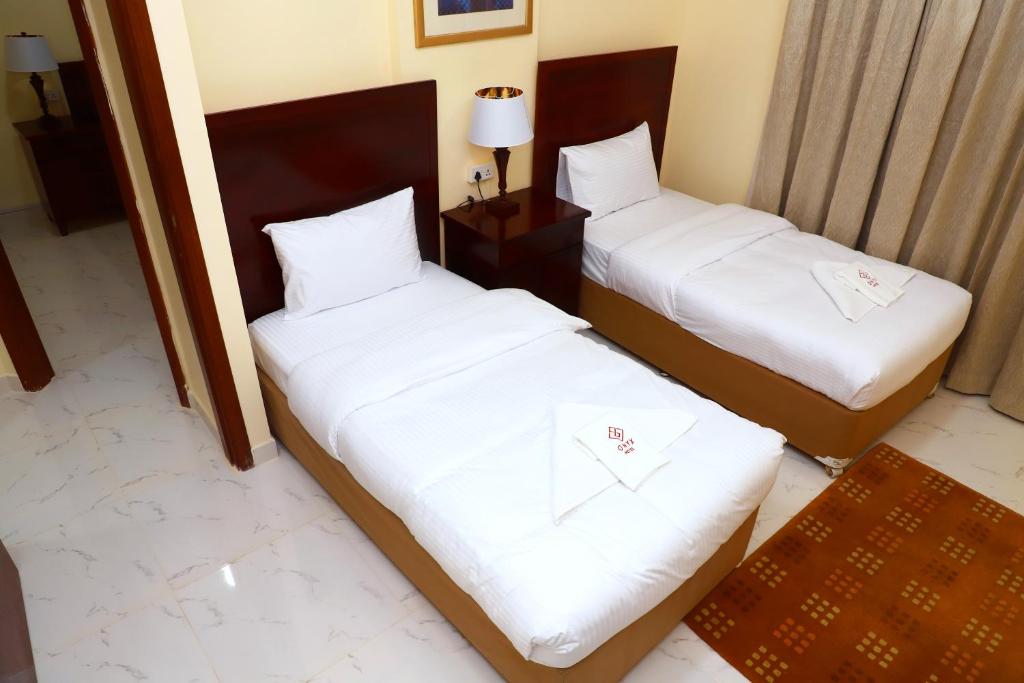 Postel nebo postele na pokoji v ubytování Onyx Hotel Apartments - MAHA HOSPITALITY GROUP