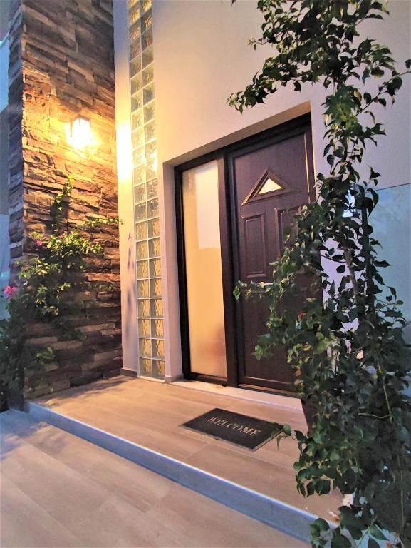 a front door of a house with a window at Villa Pavlina in Ixia