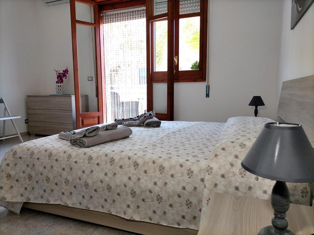 Postel nebo postele na pokoji v ubytování Casa Vacanze Samuel Beach