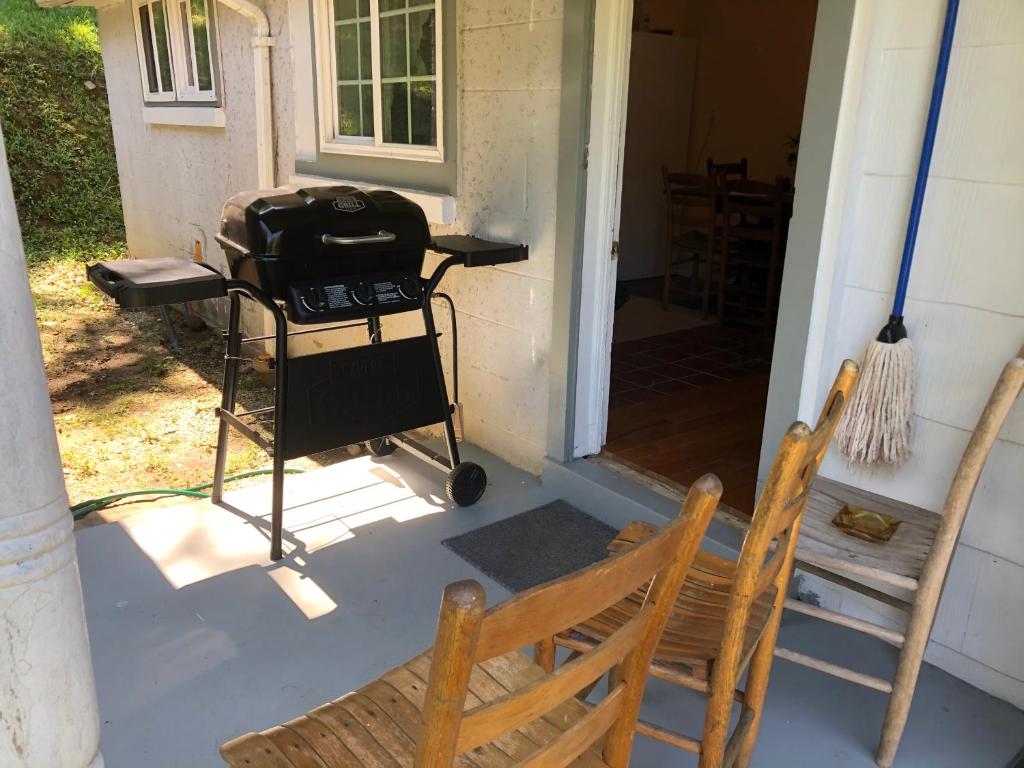 a grill on the porch of a house at Cochran Farm House in Bryson City