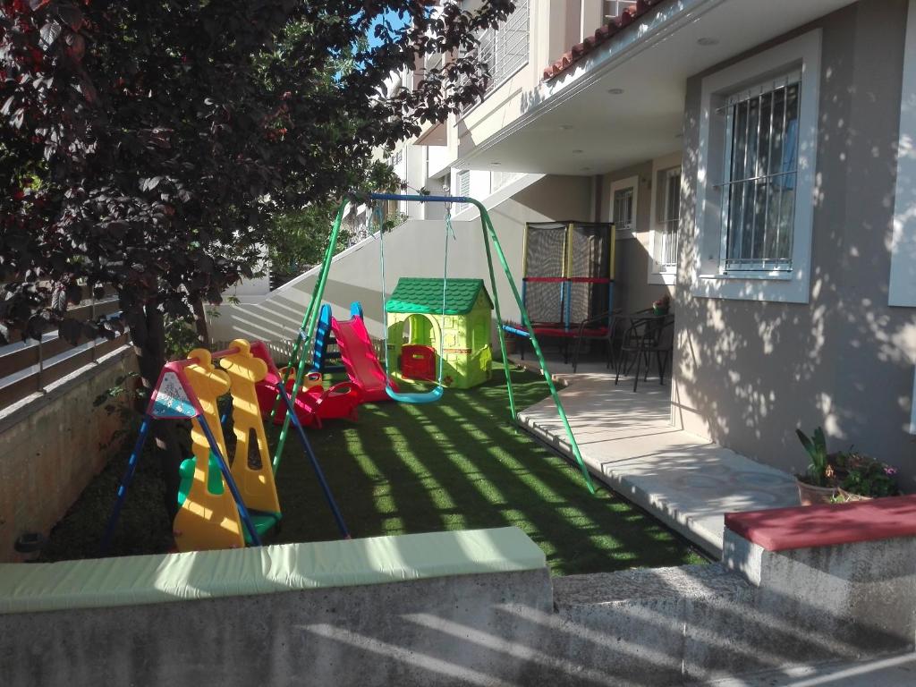 a play set on the side of a house at Maria's Apartment Nafplio in Nafplio
