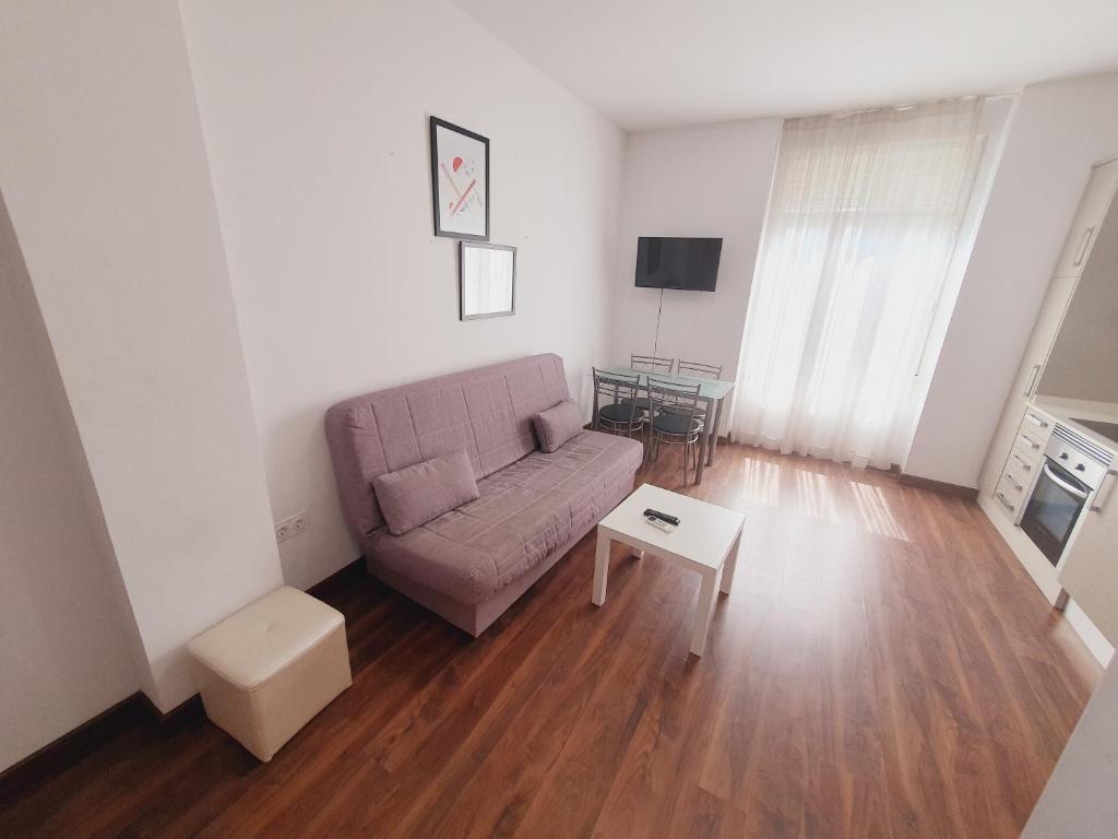 A television and/or entertainment centre at Luxury Apartments Puerto Valencia