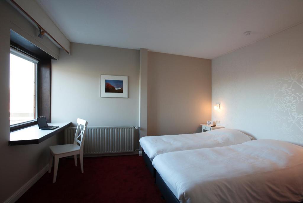 Postel nebo postele na pokoji v ubytování Hotel Restaurant Riche