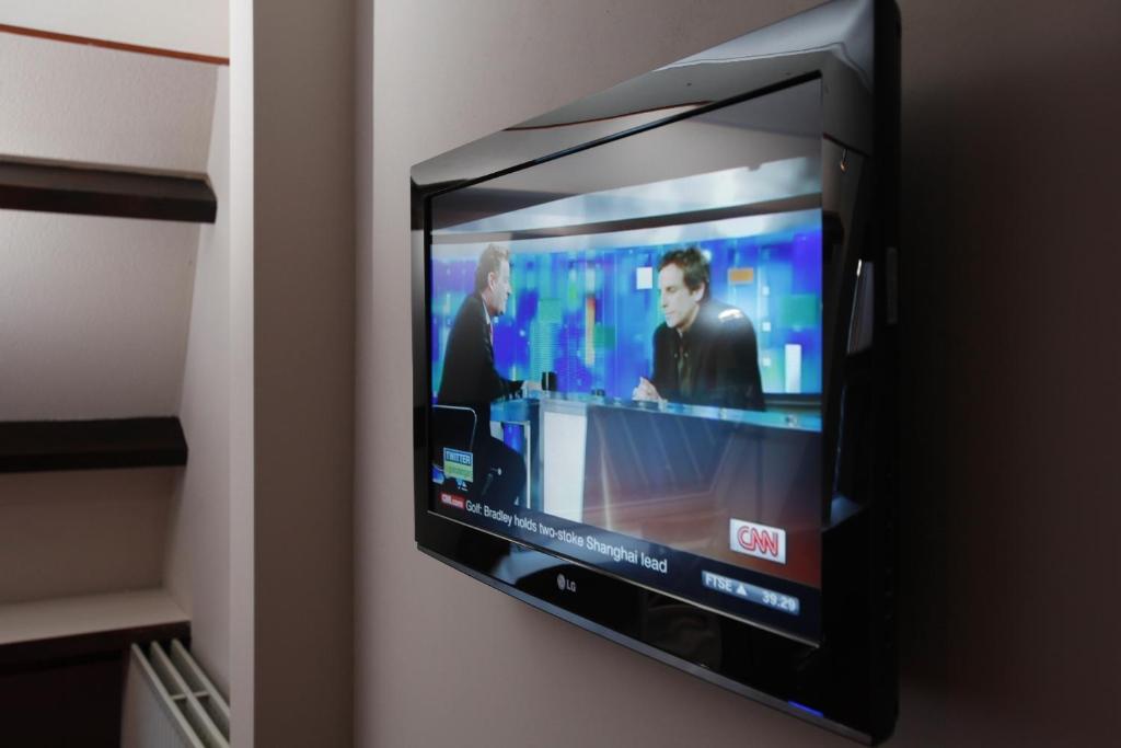 TV a/nebo společenská místnost v ubytování Hotel Restaurant Riche