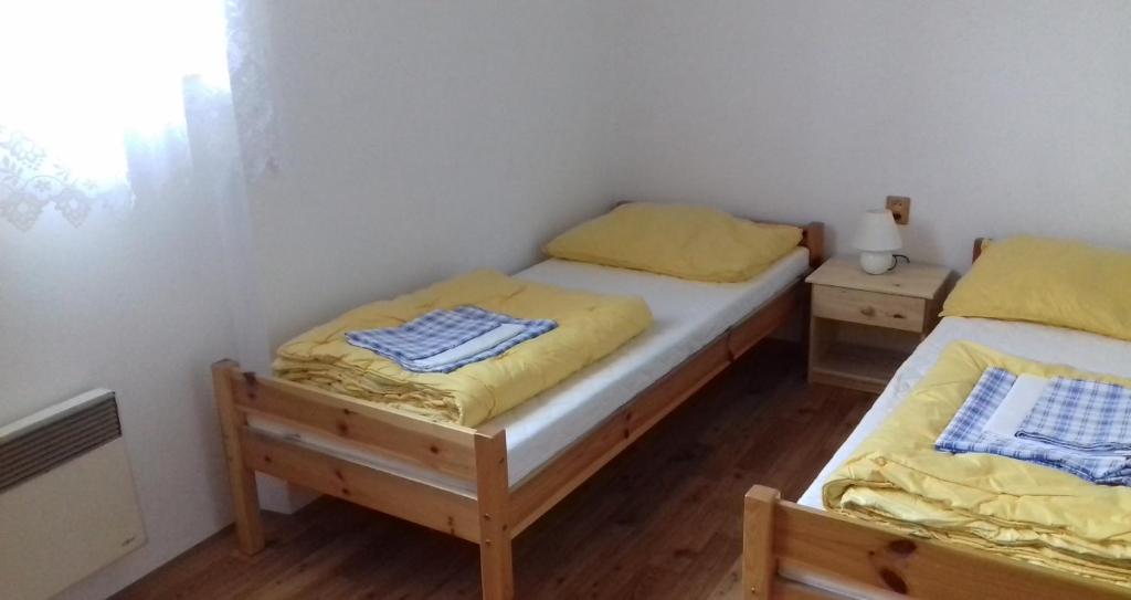Postel nebo postele na pokoji v ubytování Blatský dvůr