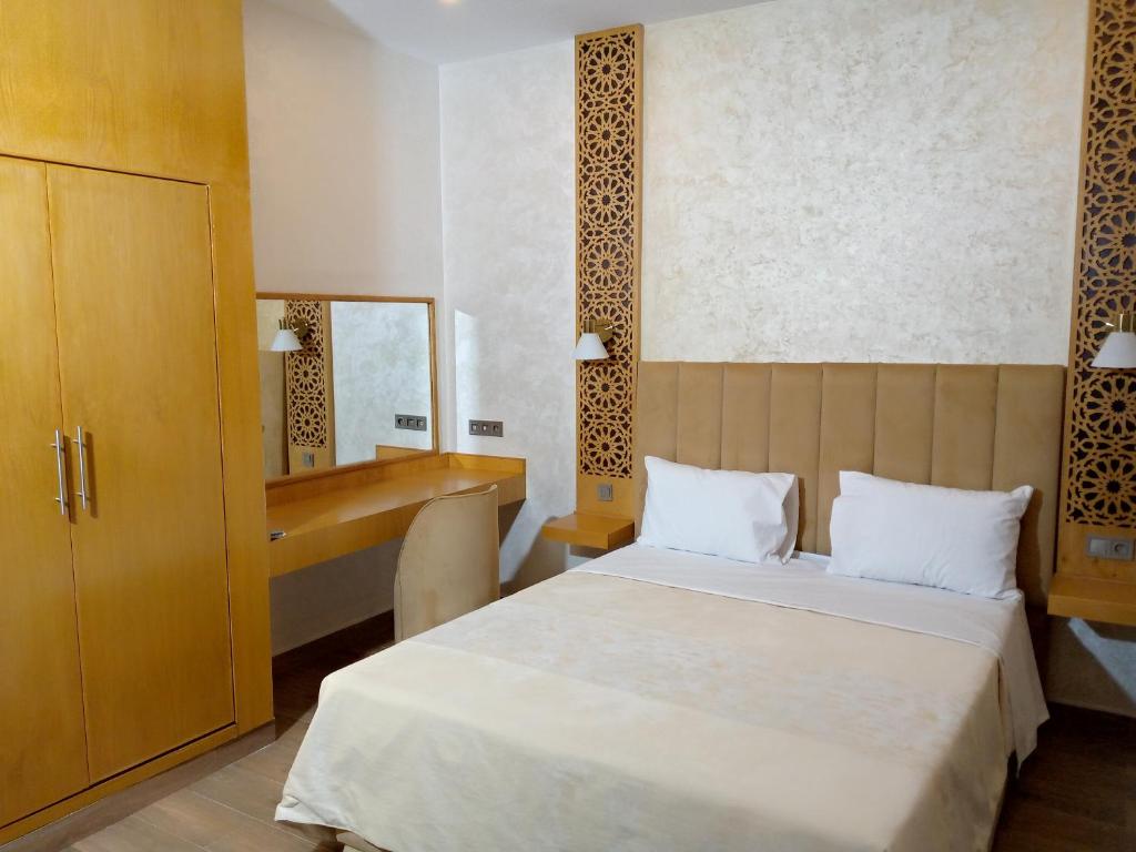 Postel nebo postele na pokoji v ubytování Palm’s Motel