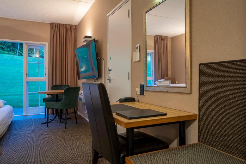 Postel nebo postele na pokoji v ubytování Wallaceville Motor Lodge