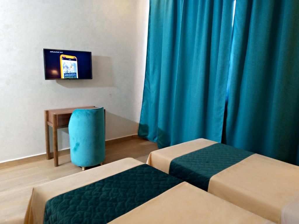 Postel nebo postele na pokoji v ubytování Palm’s Motel