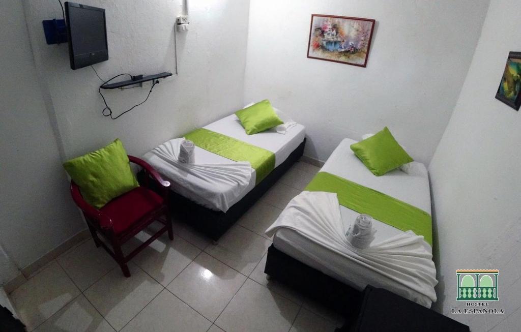 Postel nebo postele na pokoji v ubytování Hostal La Española de Getsemani