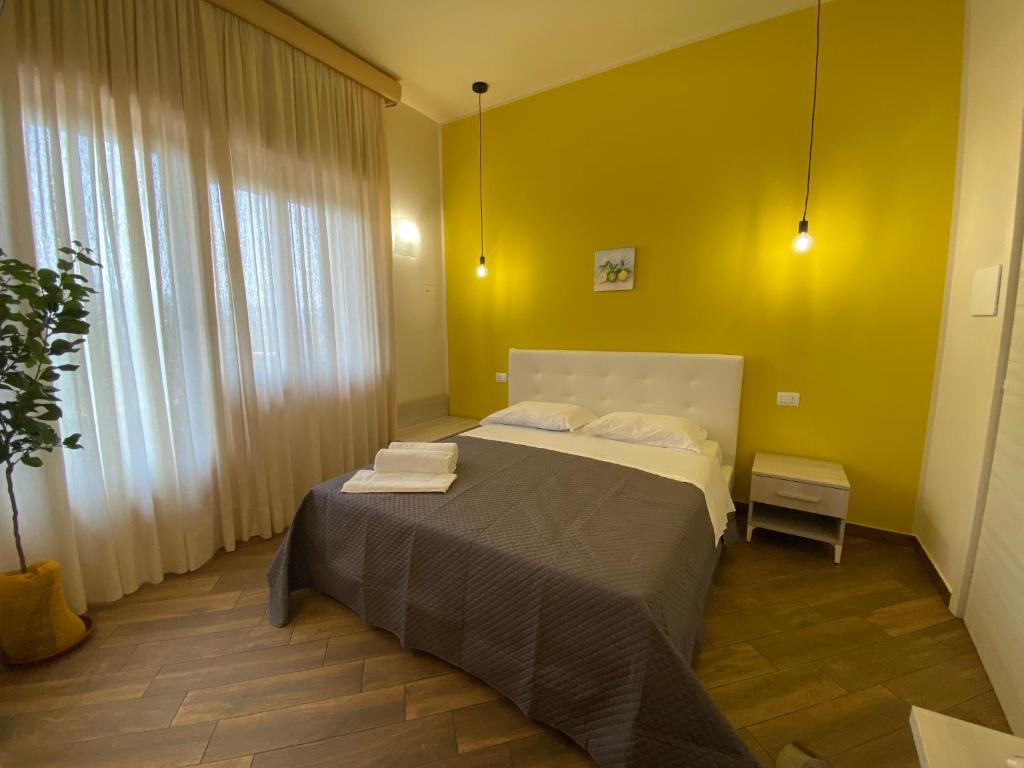 Łóżko lub łóżka w pokoju w obiekcie All’Anoneto B&B