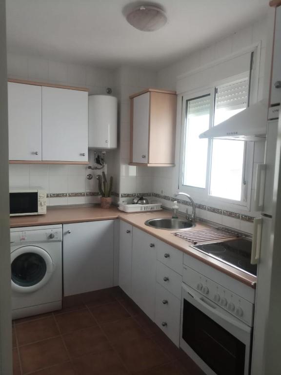 A kitchen or kitchenette at ALCARAVAN 50