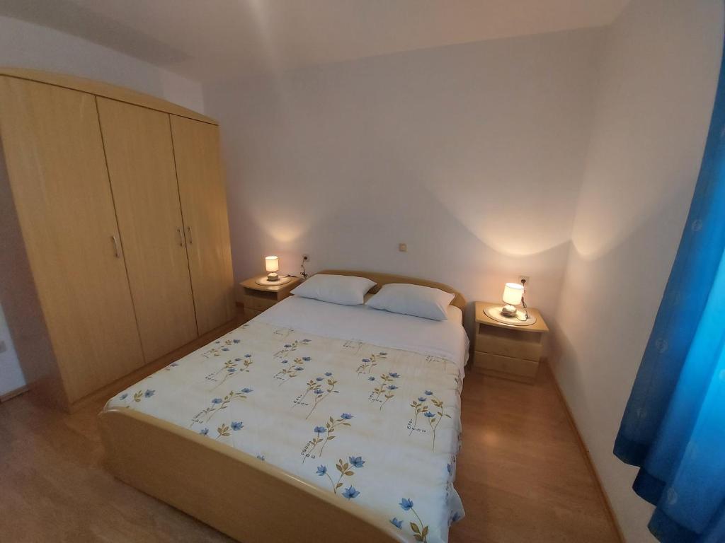 Postel nebo postele na pokoji v ubytování Apartments Elizabeta