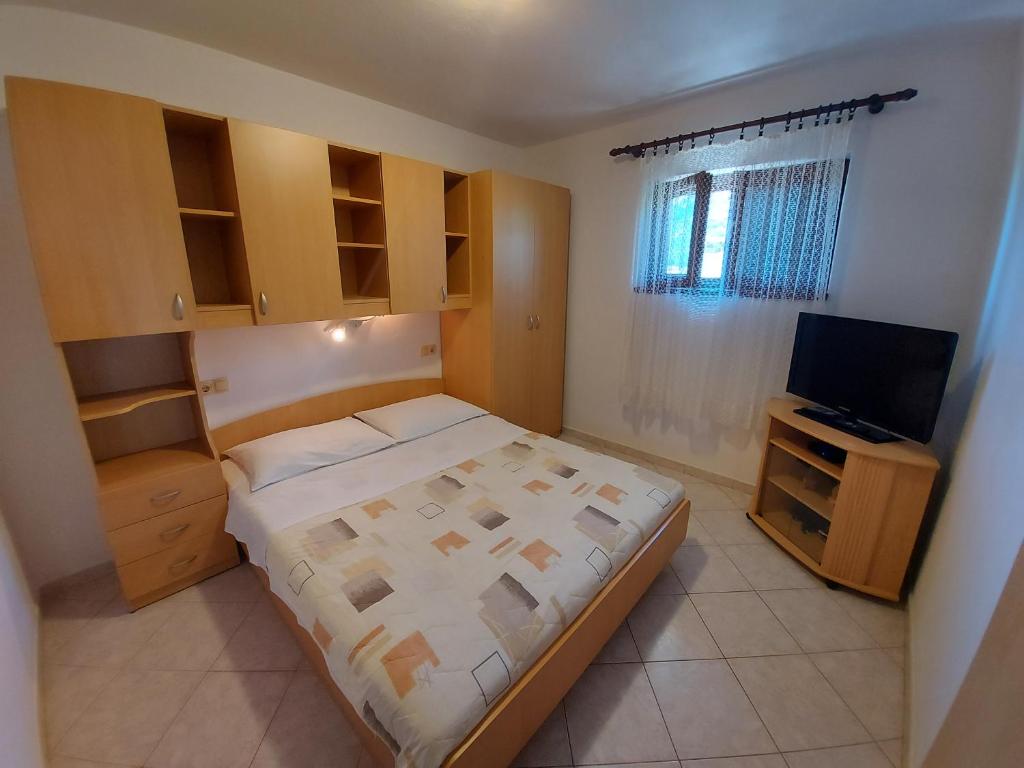 Postel nebo postele na pokoji v ubytování Apartments Elizabeta