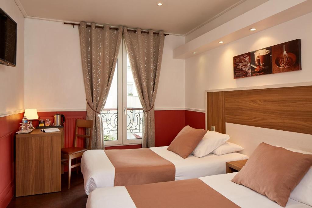 Posteľ alebo postele v izbe v ubytovaní Grand Hotel Nouvel Opera