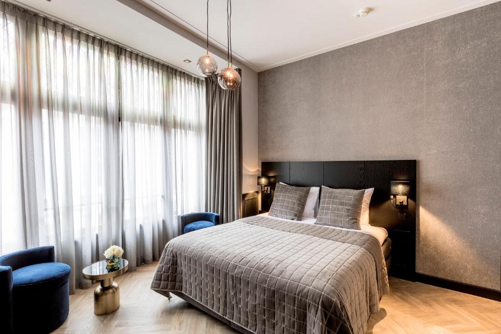Säng eller sängar i ett rum på Cavallaro Hotel
