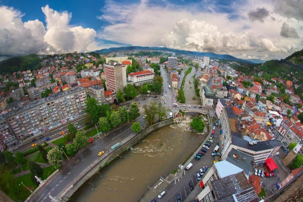 an aerial view of a city with a river at BHN ТОП ЦЕНТЪР СТУДИО in Gabrovo