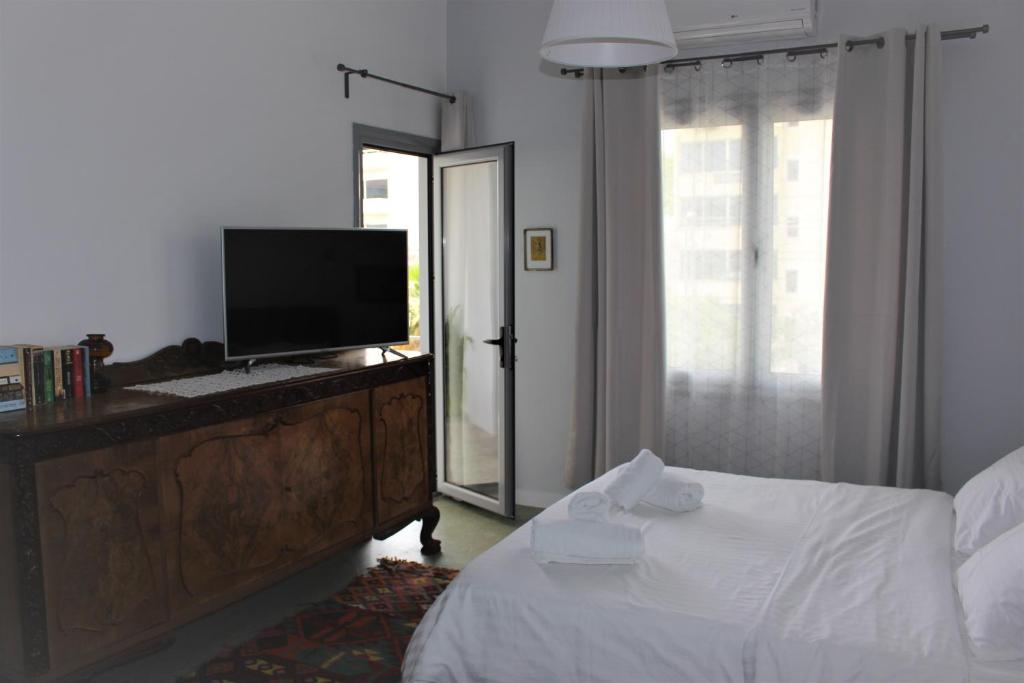 Postel nebo postele na pokoji v ubytování A litte Taste of Home Guest House