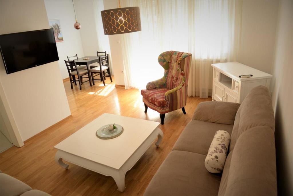 a living room with a couch and a table at Centar in Bijeljina