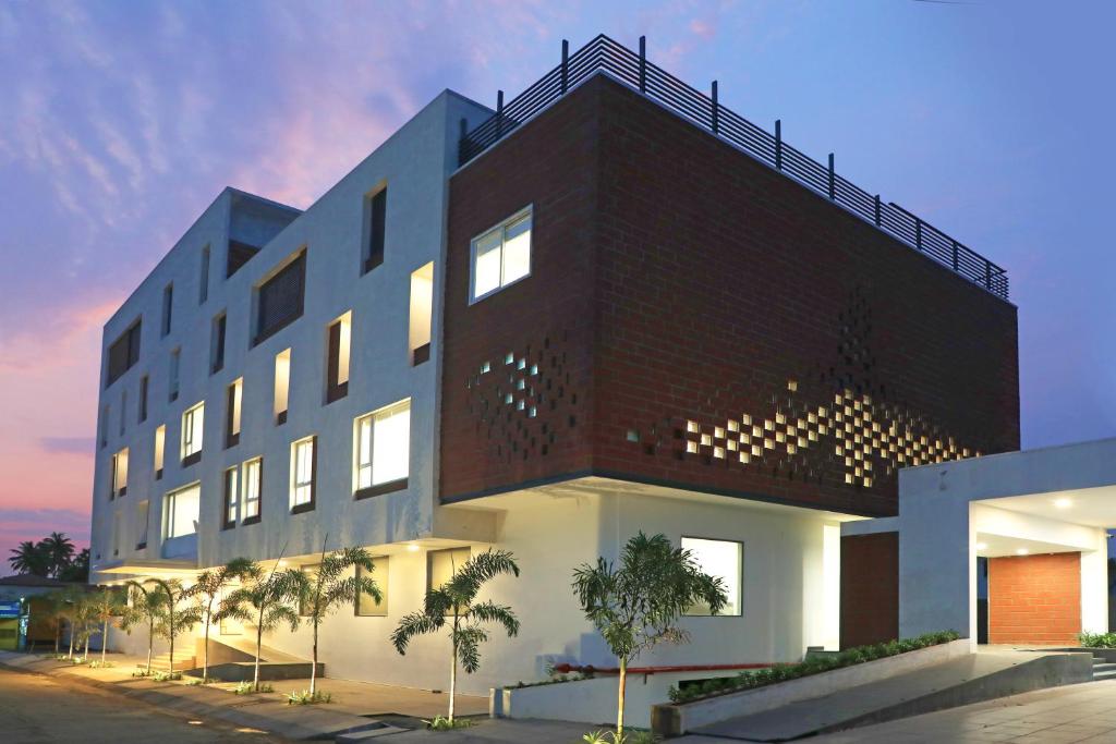 a large building with a brick at GG HOTELS in Tiruppūr