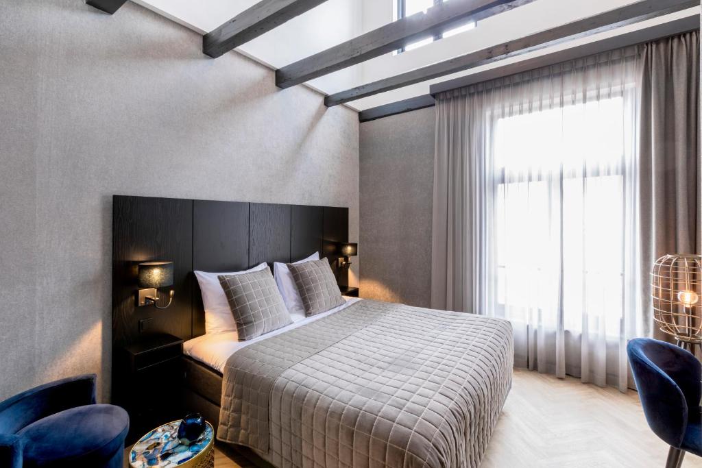 Postel nebo postele na pokoji v ubytování Cavallaro Hotel