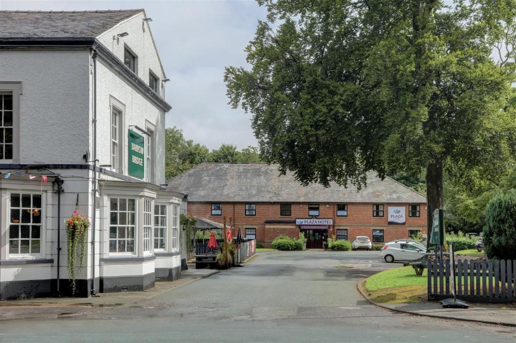 a street in a small town with buildings at Plaza Hotel, Chorley, Sure Collection By BW in Chorley