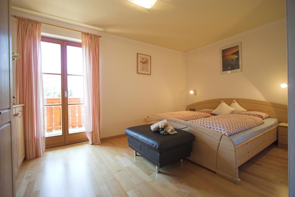 Postel nebo postele na pokoji v ubytování Apartments Dilln Gütl