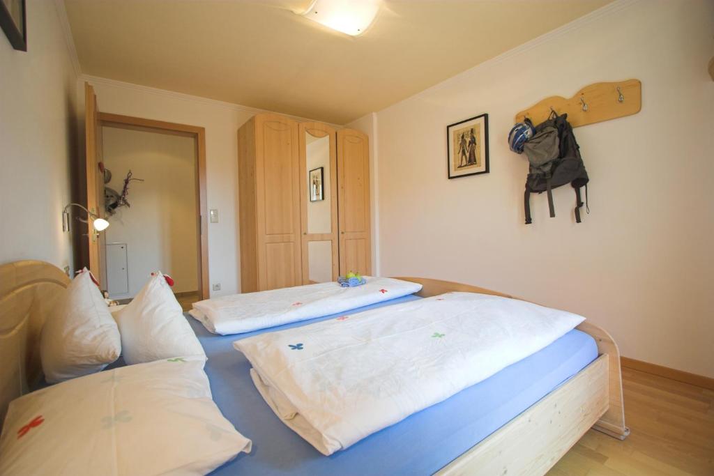 Postel nebo postele na pokoji v ubytování Apartments Dilln Gütl