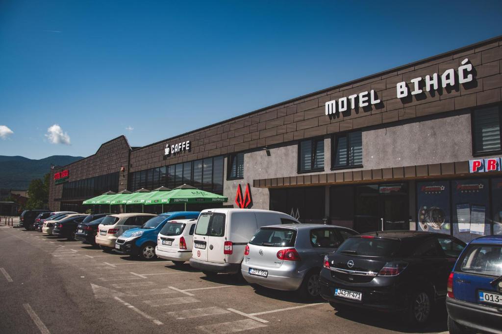 a row of cars parked in front of a building at Motel Bihać in Bihać
