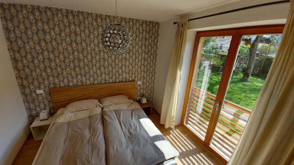 Postel nebo postele na pokoji v ubytování Apartments Supermjau
