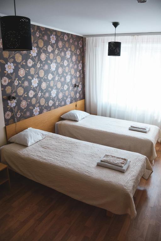 Postel nebo postele na pokoji v ubytování Vao Guesthouse