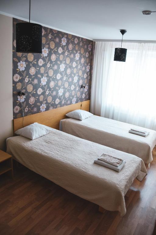 Postel nebo postele na pokoji v ubytování Vao Guesthouse
