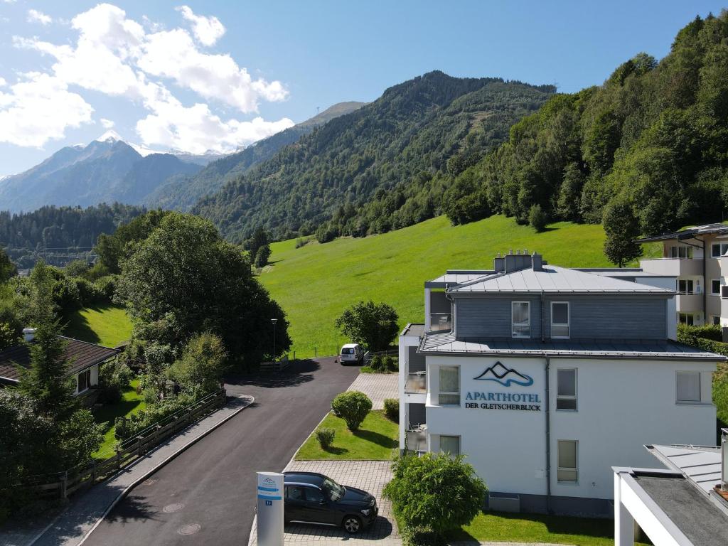 a view from the balcony of a building with mountains in the background at Finest Apartments Glacier View by All in One Apartments in Kaprun