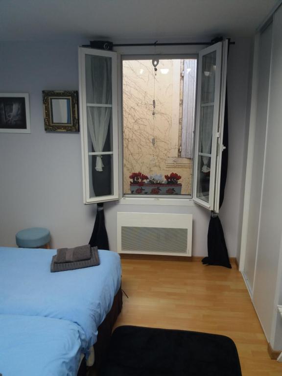 Postel nebo postele na pokoji v ubytování Gîte de Claire