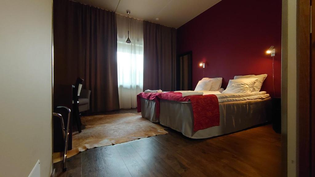 Postel nebo postele na pokoji v ubytování Hotel Guossi