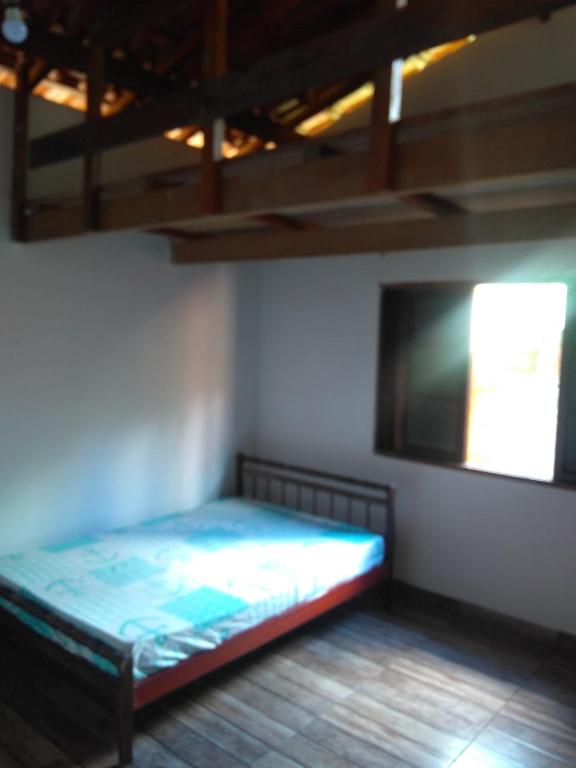 Postel nebo postele na pokoji v ubytování Casa de temporada Lindas Cachoeiras 10
