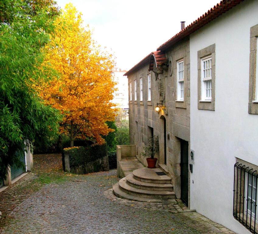 a house with a pathway next to a building at Casa da Aldeia in Sever do Vouga