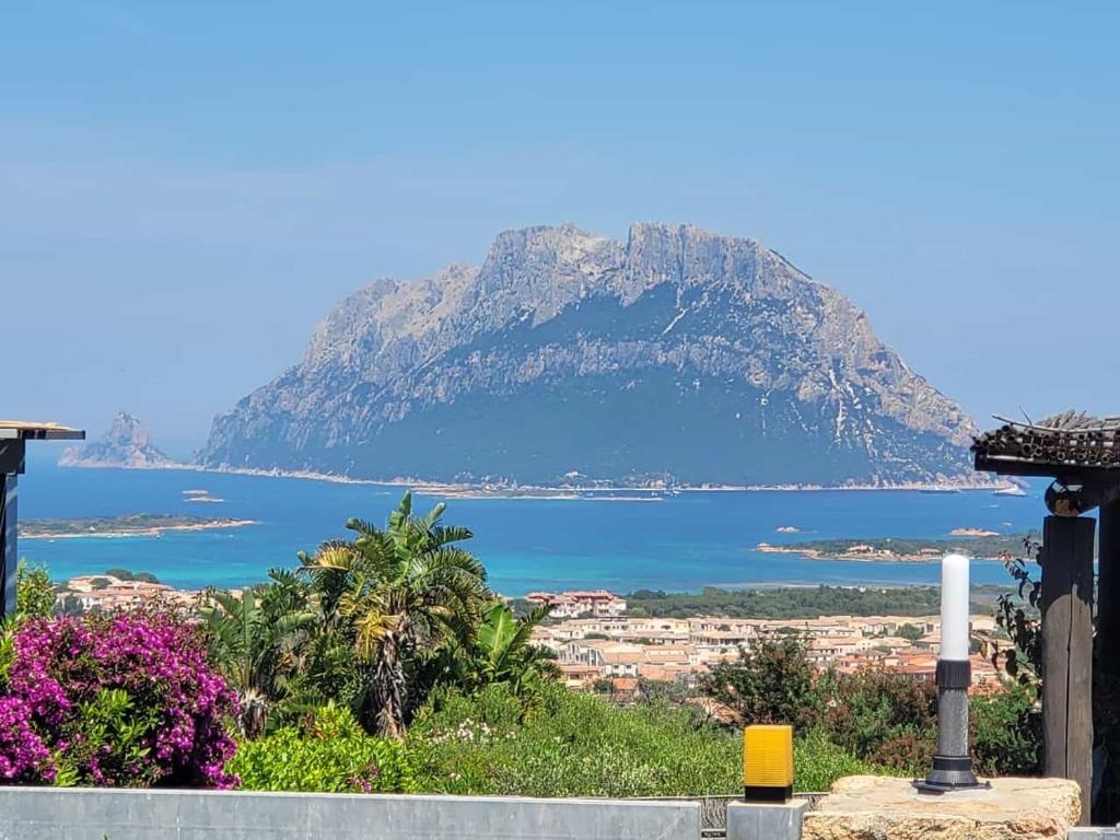 a view of a mountain and a body of water at Claude&Kate's dream house in Porto San Paolo
