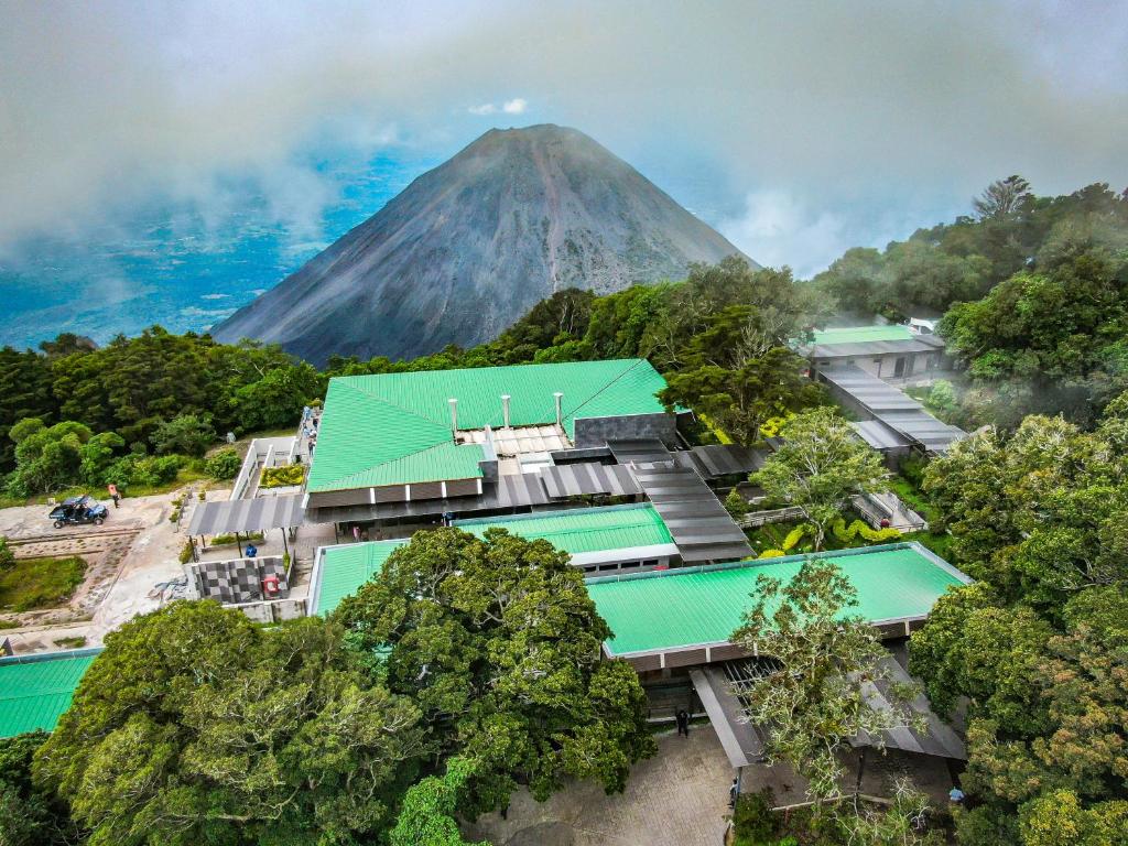 an aerial view of a building with a mountain in the background at Casa 1800 Cerro Verde in Cerro Verde