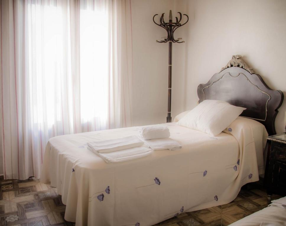Posteľ alebo postele v izbe v ubytovaní Casa Rural La CasAna