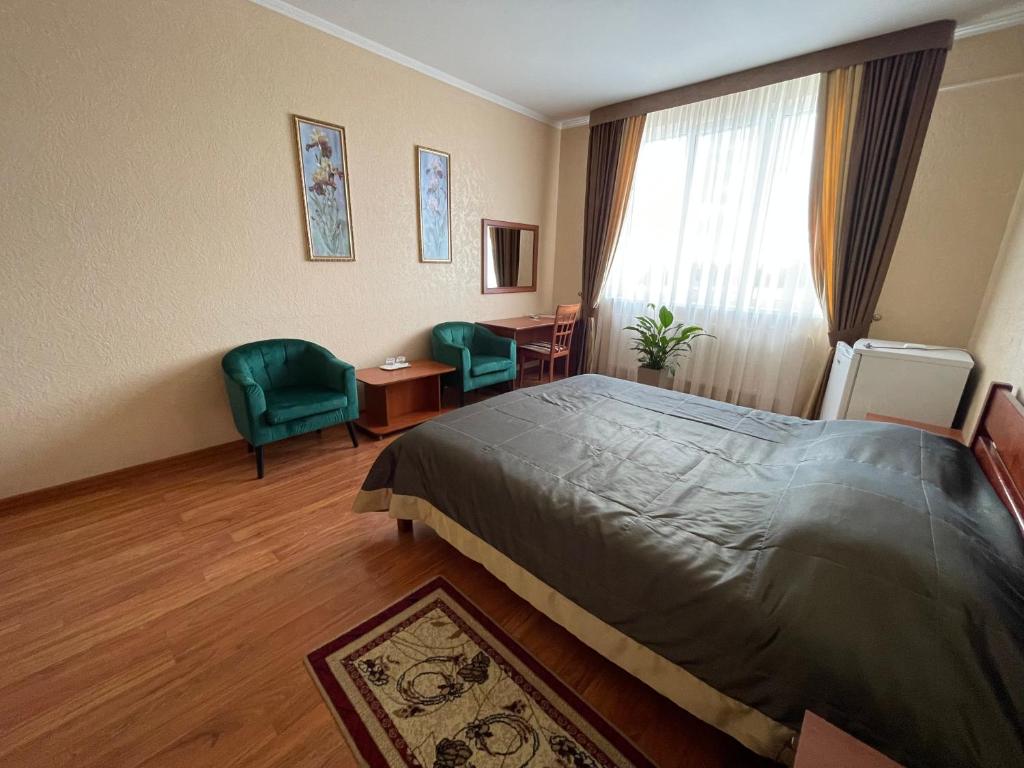 Postel nebo postele na pokoji v ubytování Yunist
