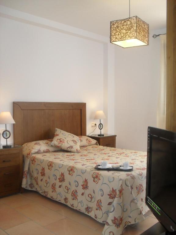 Cama o camas de una habitación en Los Castillarejos Apartamentos Rurales