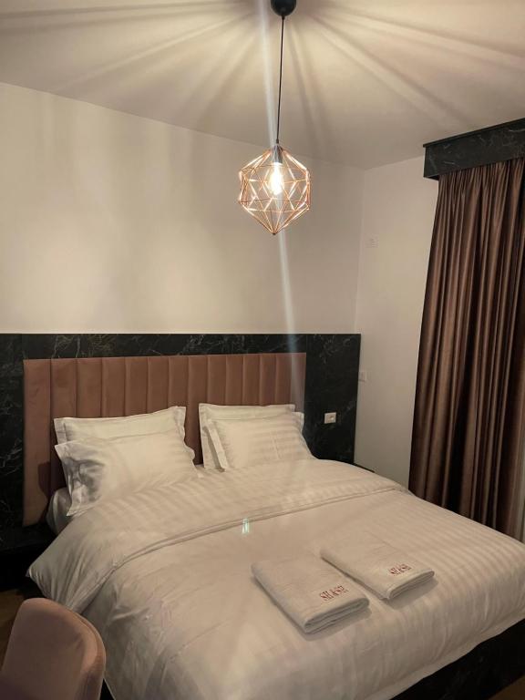 Letto o letti in una camera di Hotel SH & SH