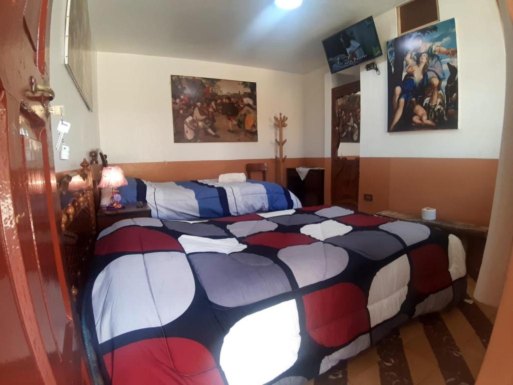 Postel nebo postele na pokoji v ubytování HOSPEDAJE CENTRAL