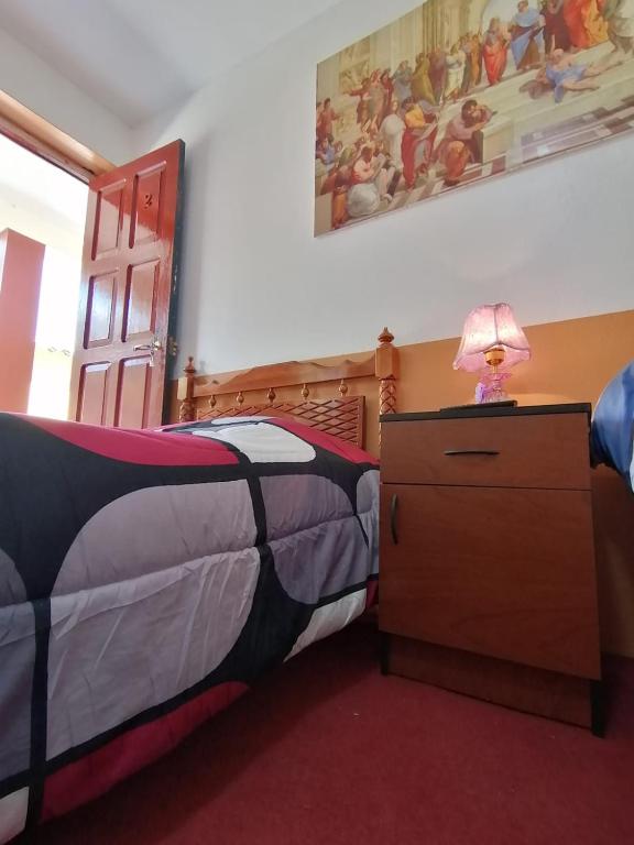 Postel nebo postele na pokoji v ubytování HOSPEDAJE CENTRAL
